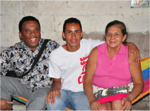 Pastor Robinson with Carlos Ponce and his mother