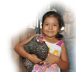 Six-year-old Camila Cerén and her pet chicken